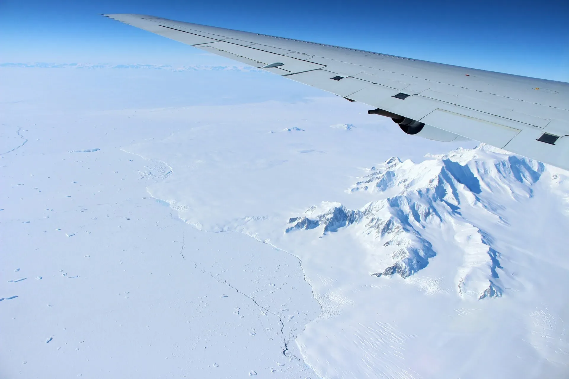 Snow-covered mountains of northern Alexander Island in Antarctica, seen from an aircraft window