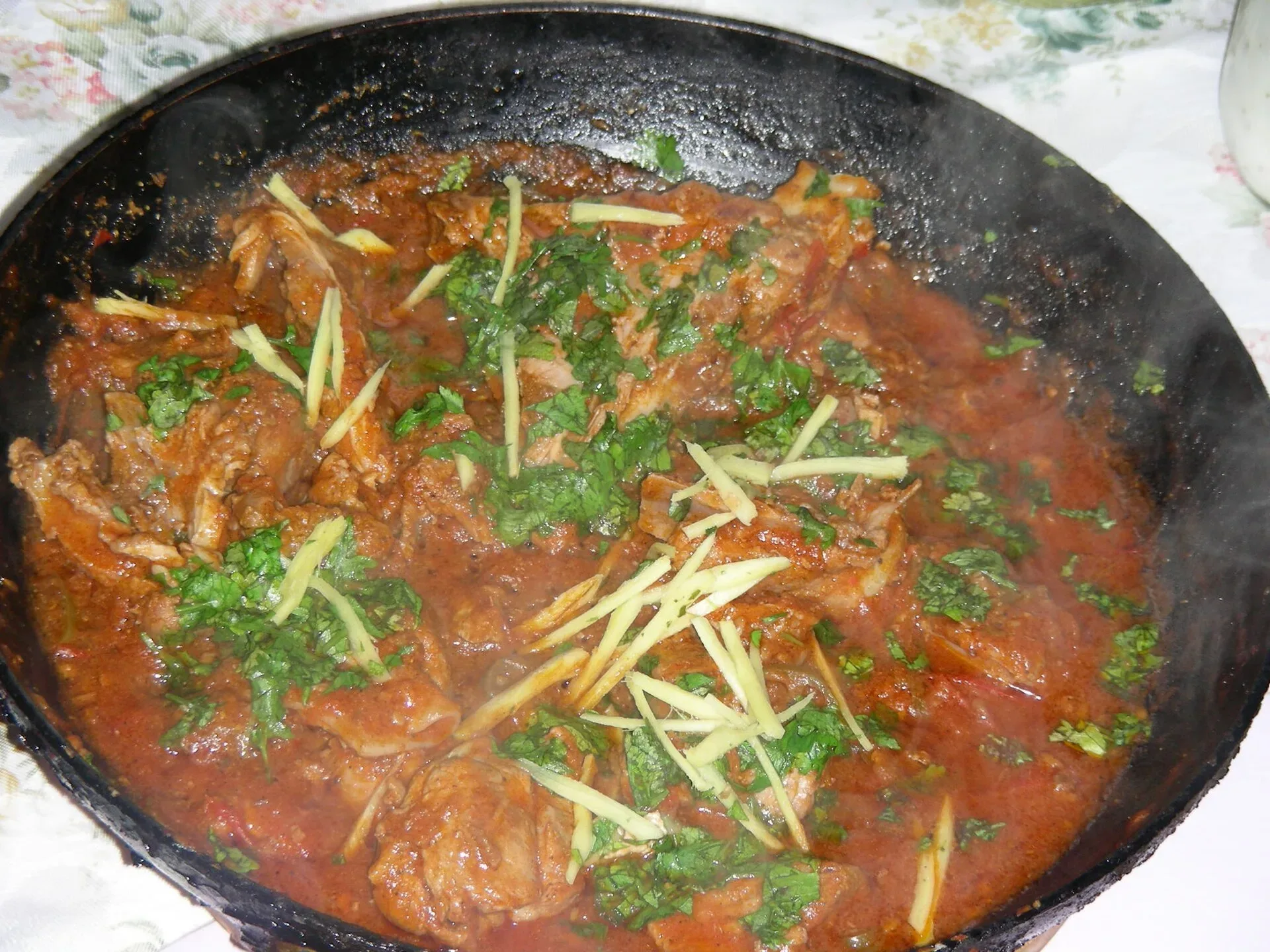 A lamb balti served in its cooking pan