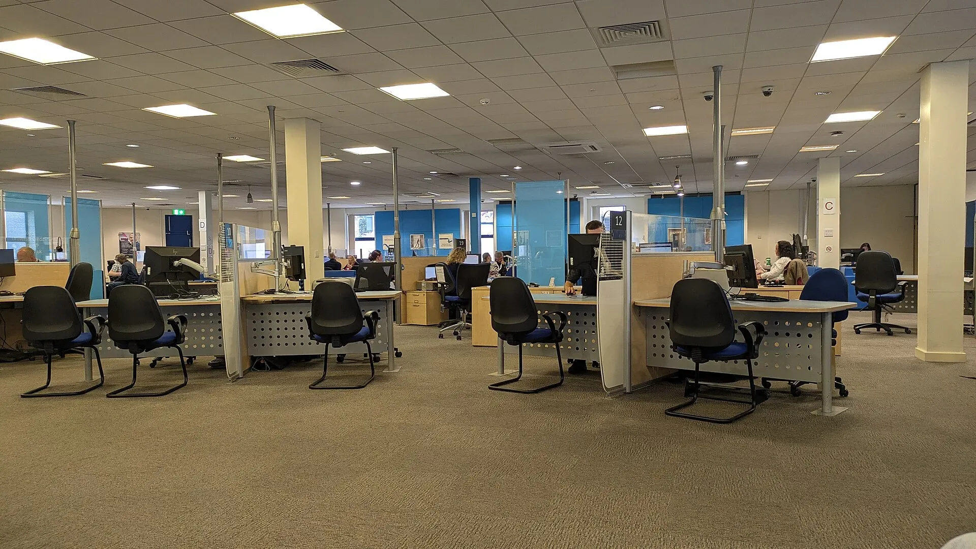 Desks and computers inside a Jobcentre Plus office
