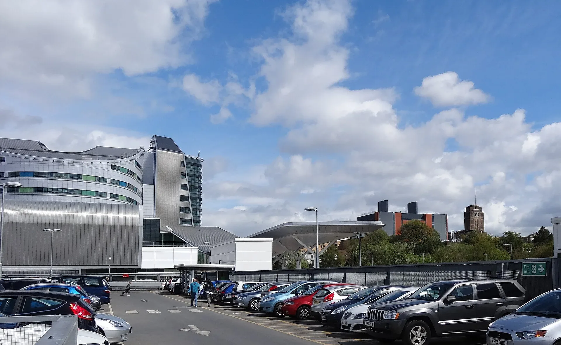 The curved entrance canopy and main building of the Queen Elizabeth Hospital Birmingham