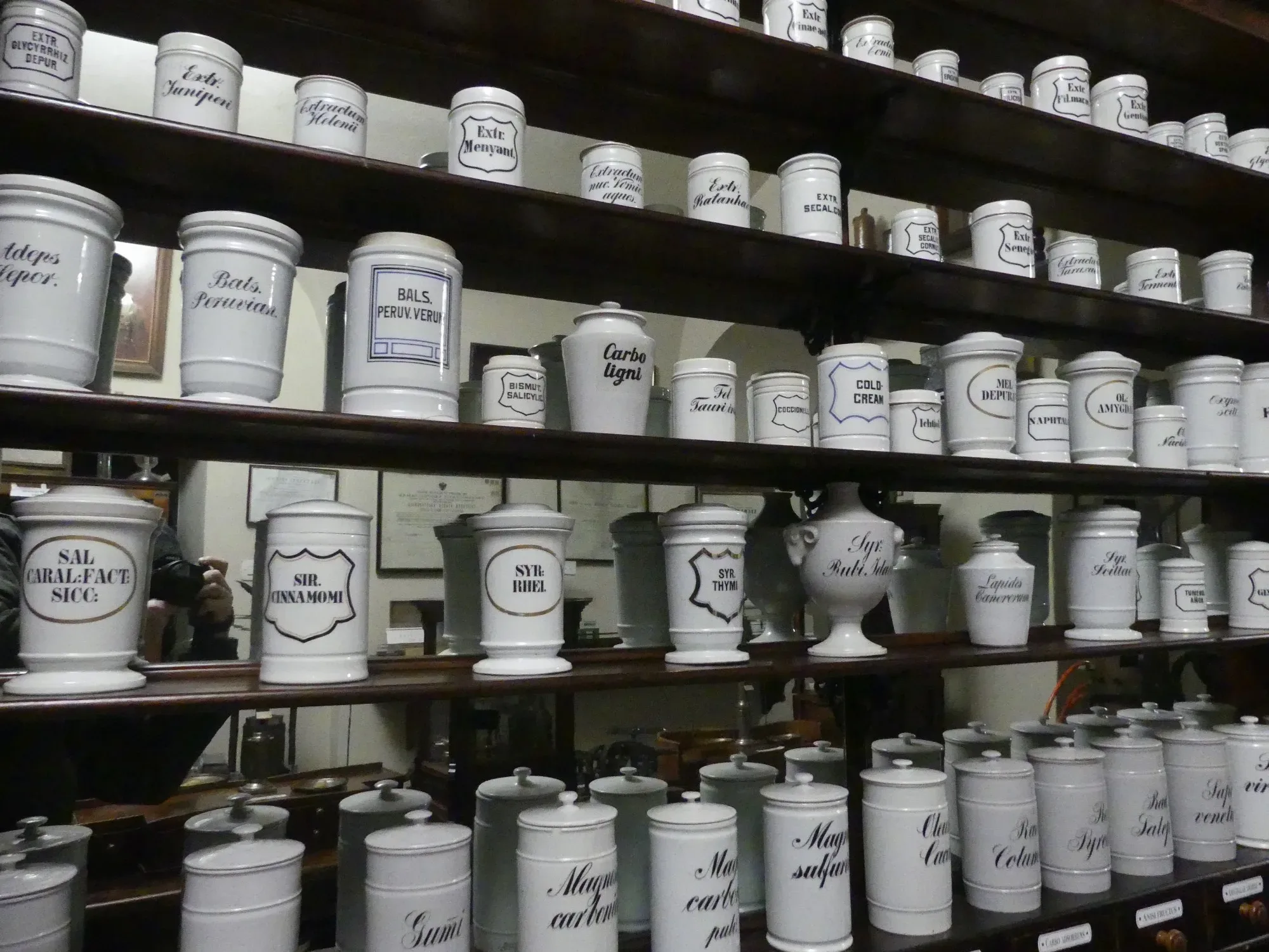 Shelves of old pharmacy jars in a former chemist's shop