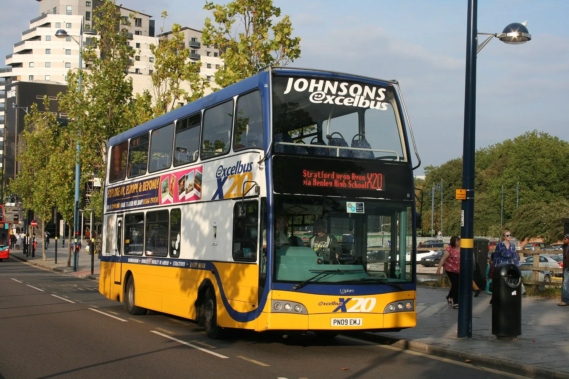 A yellow and blue double-decker bus on Moor Street in Birmingham