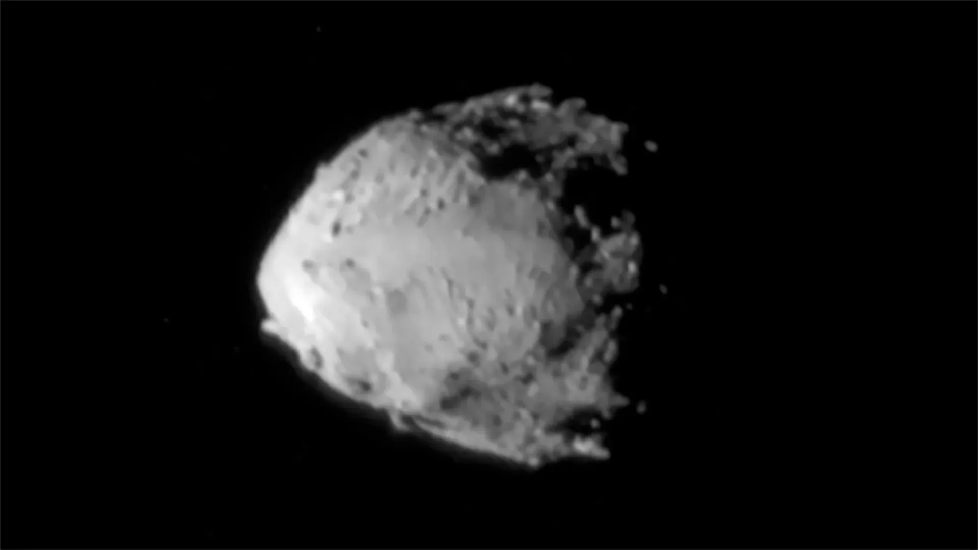The grey, rocky asteroid Didymos photographed against black space