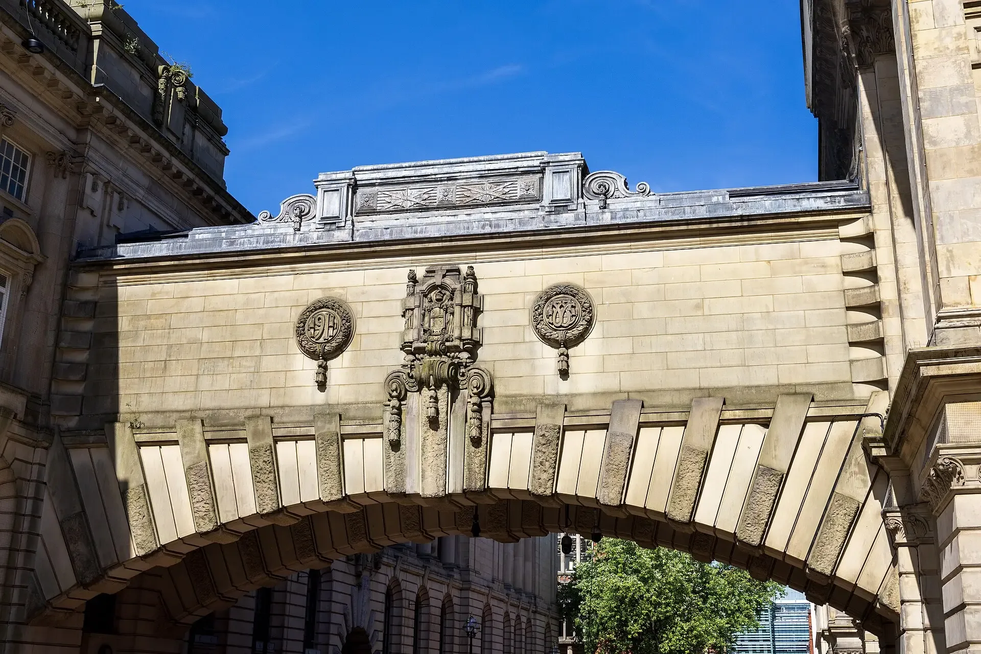 The ornate stone bridge of Birmingham Museum and Art Gallery over Edmund Street