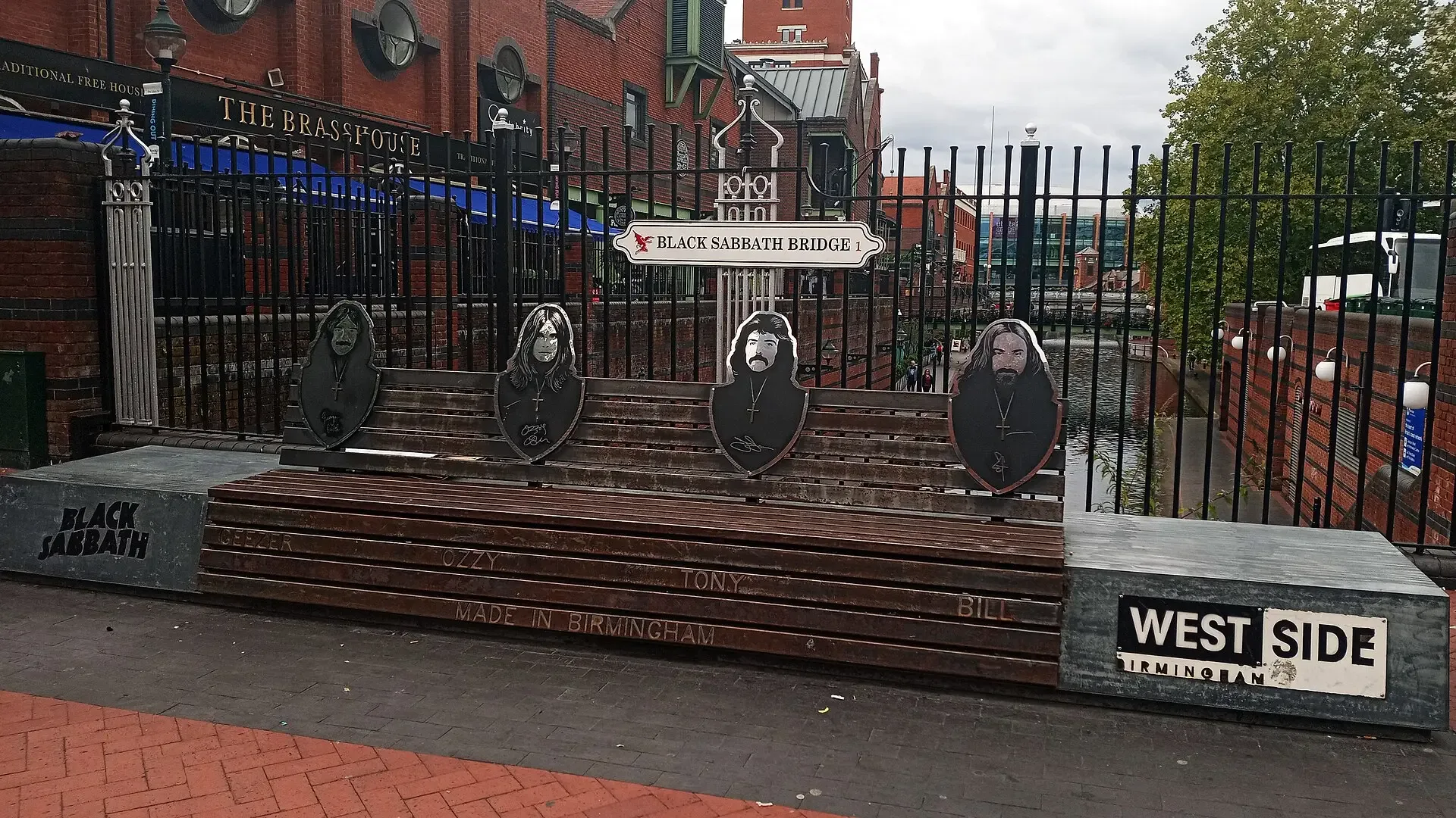 The Black Sabbath bench, with portraits of the four band members, beside Black Sabbath Bridge on Broad Street