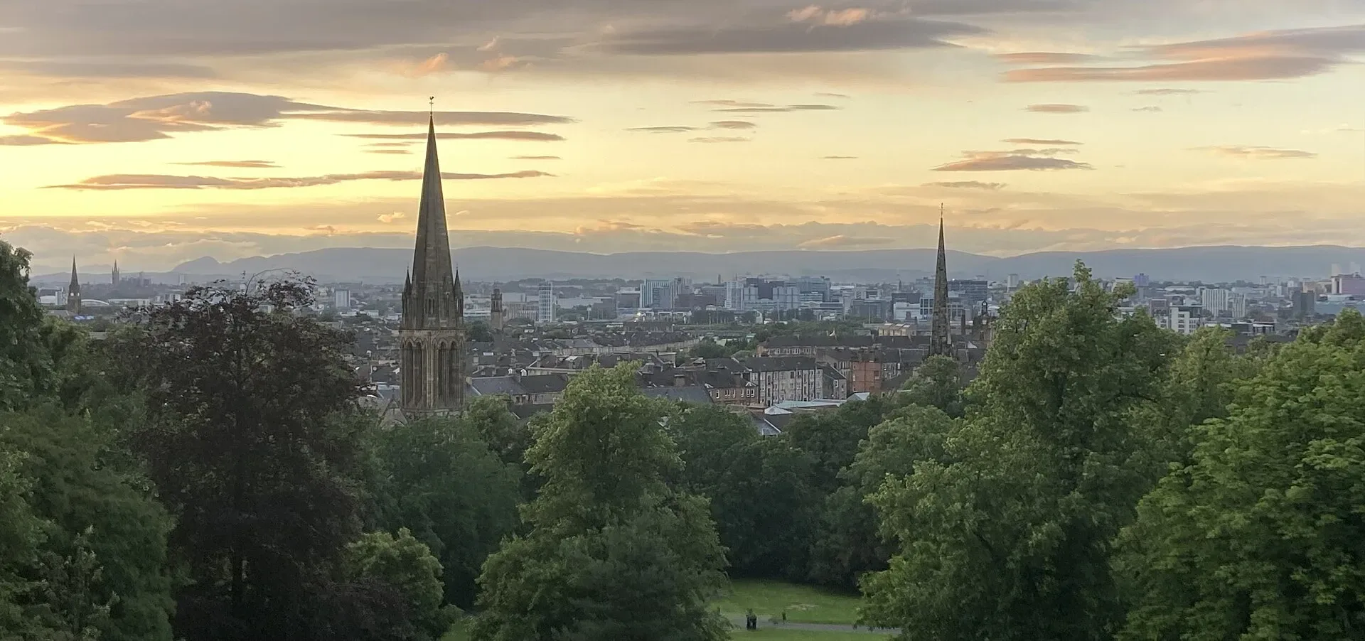 A panorama of Glasgow's skyline from Queen's Park at sunset
