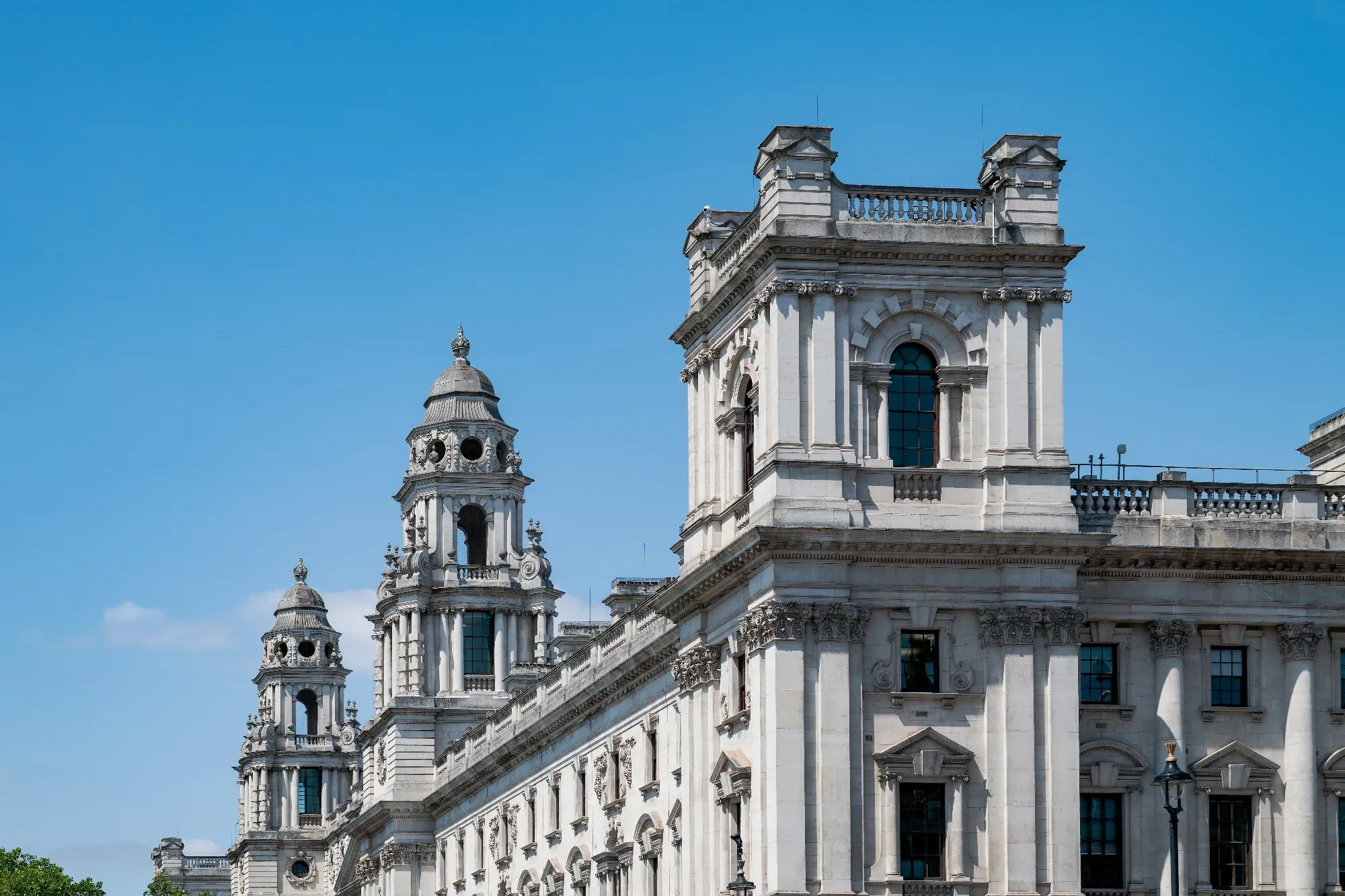 The HM Treasury building on Whitehall, London, under a blue sky