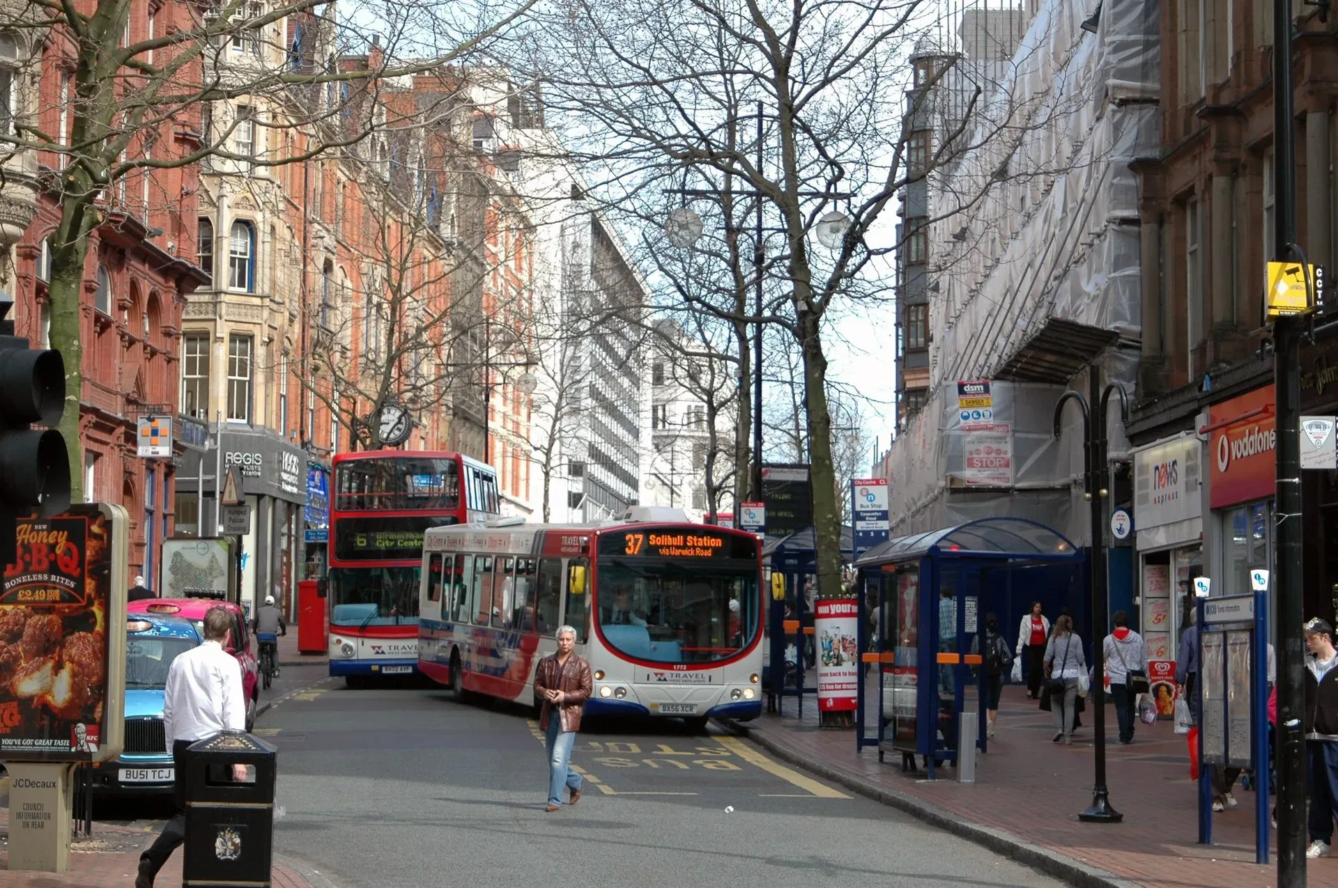 Shoppers and buses on Corporation Street in Birmingham city centre