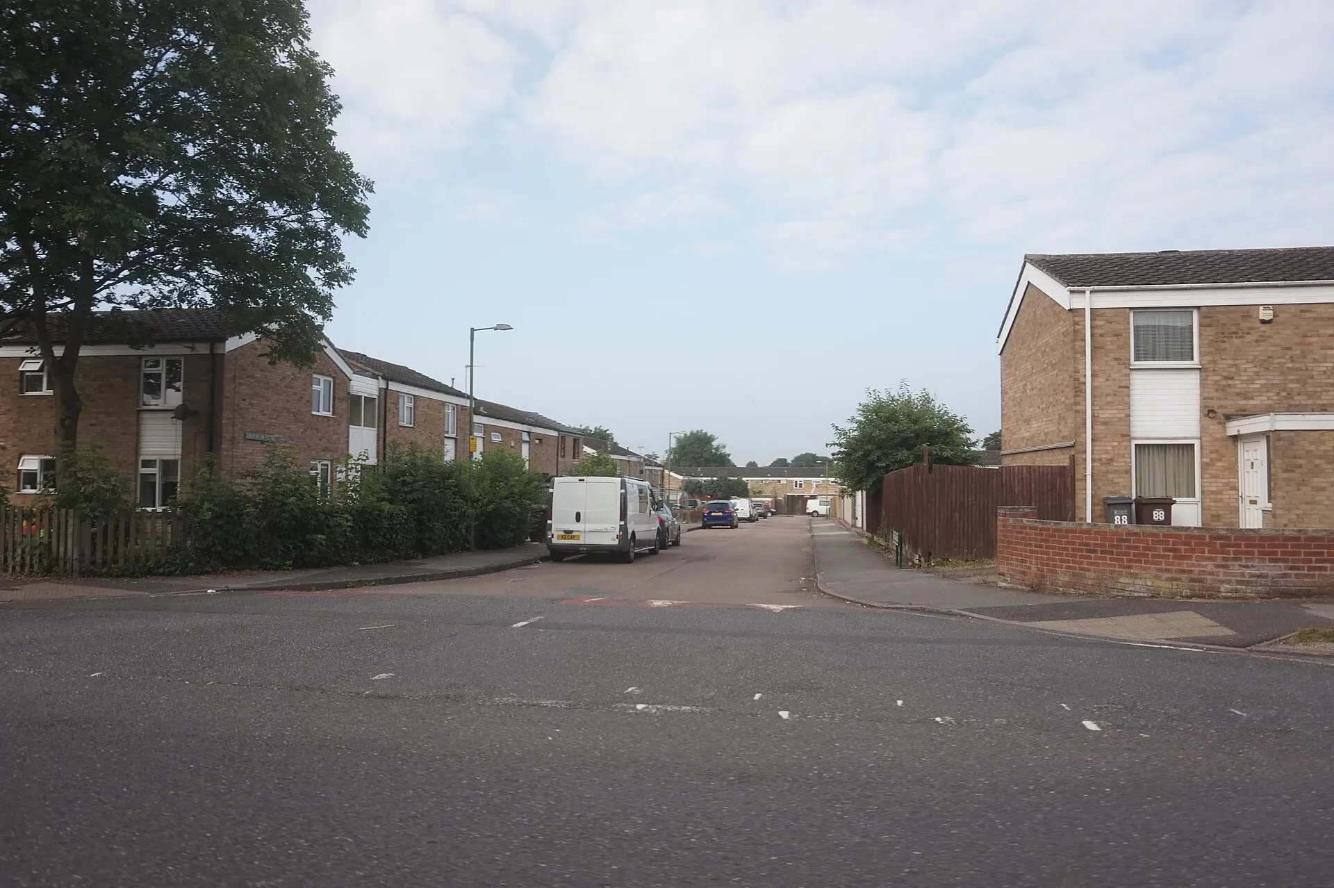 Brick houses and a quiet residential street in Chelmsley Wood